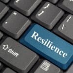 Blue Resilience key on a black computer keyboard for operational resilience.